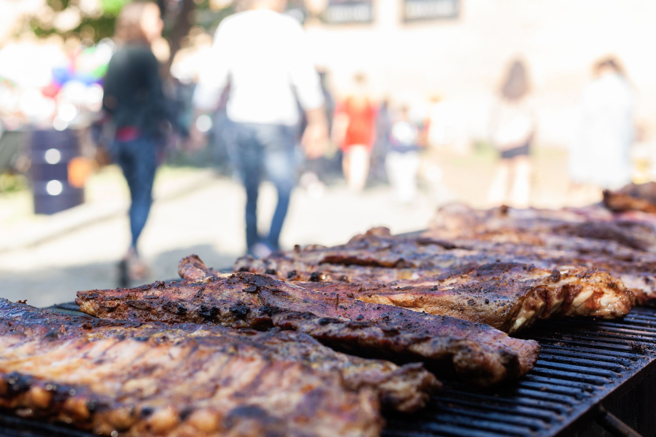Barbecue ribs cooking on an outdoor grill